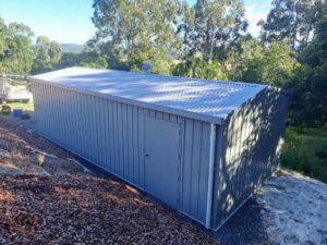 Large storage shed tucked into backyard of property