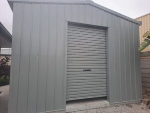 Small grey shed design with small roller door