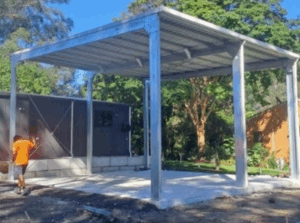 Tall, galvanised steel carport placed on concrete slab