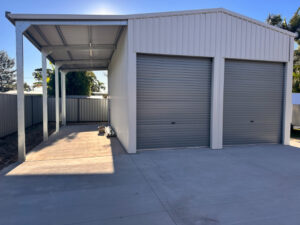 Garage with two roller doors and carport attached on the left side